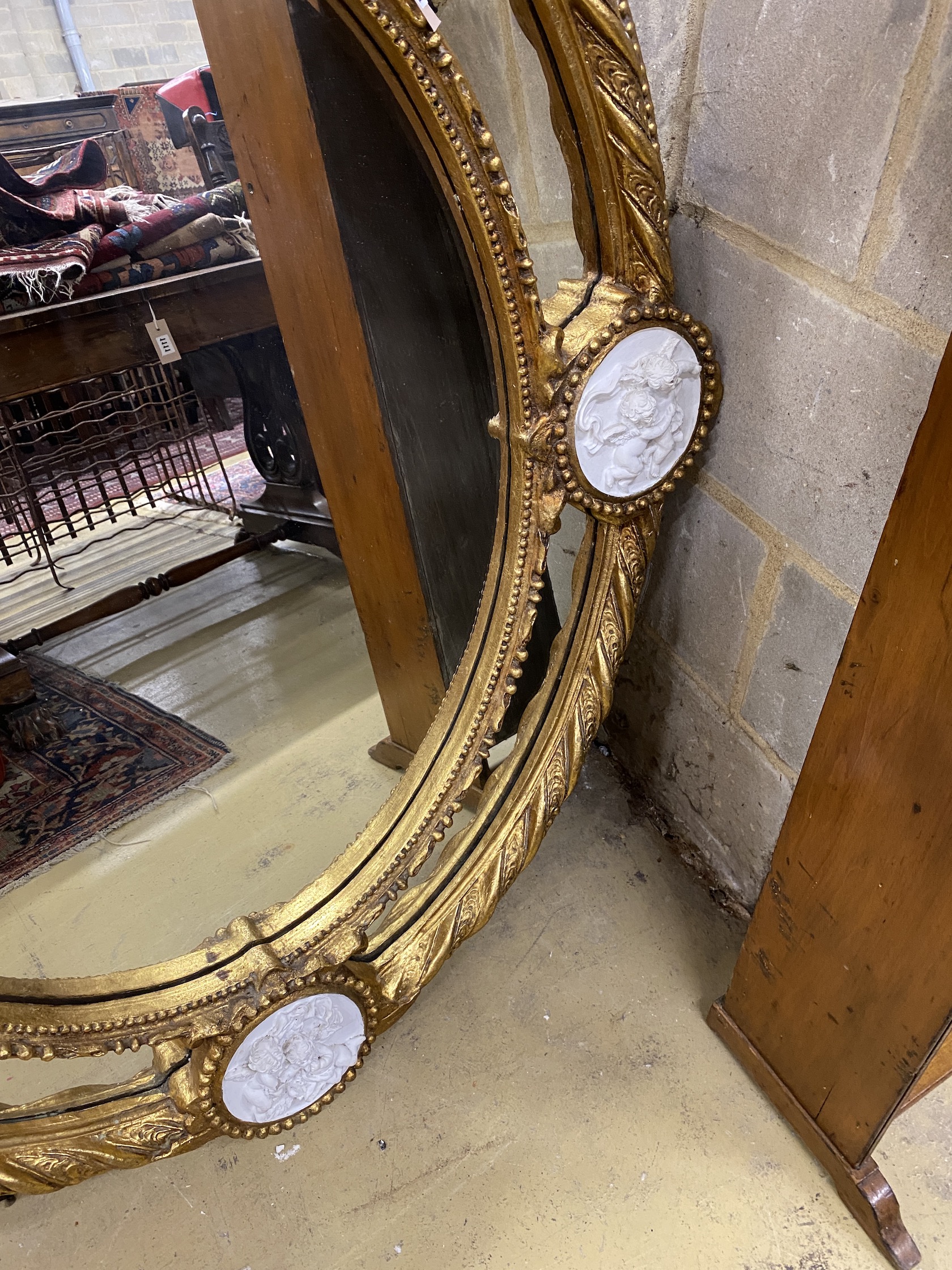 A Victorian style gilt composition and faux marble wall mirror, width 100cm, height 144cm